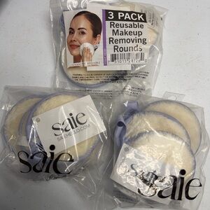 3 new packs - Saie Cream and Purple Makeup Remover Pads, each is a 3 Pack